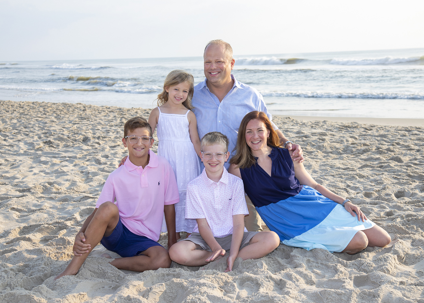 a portrait of a family on the beach in Corolla NC
