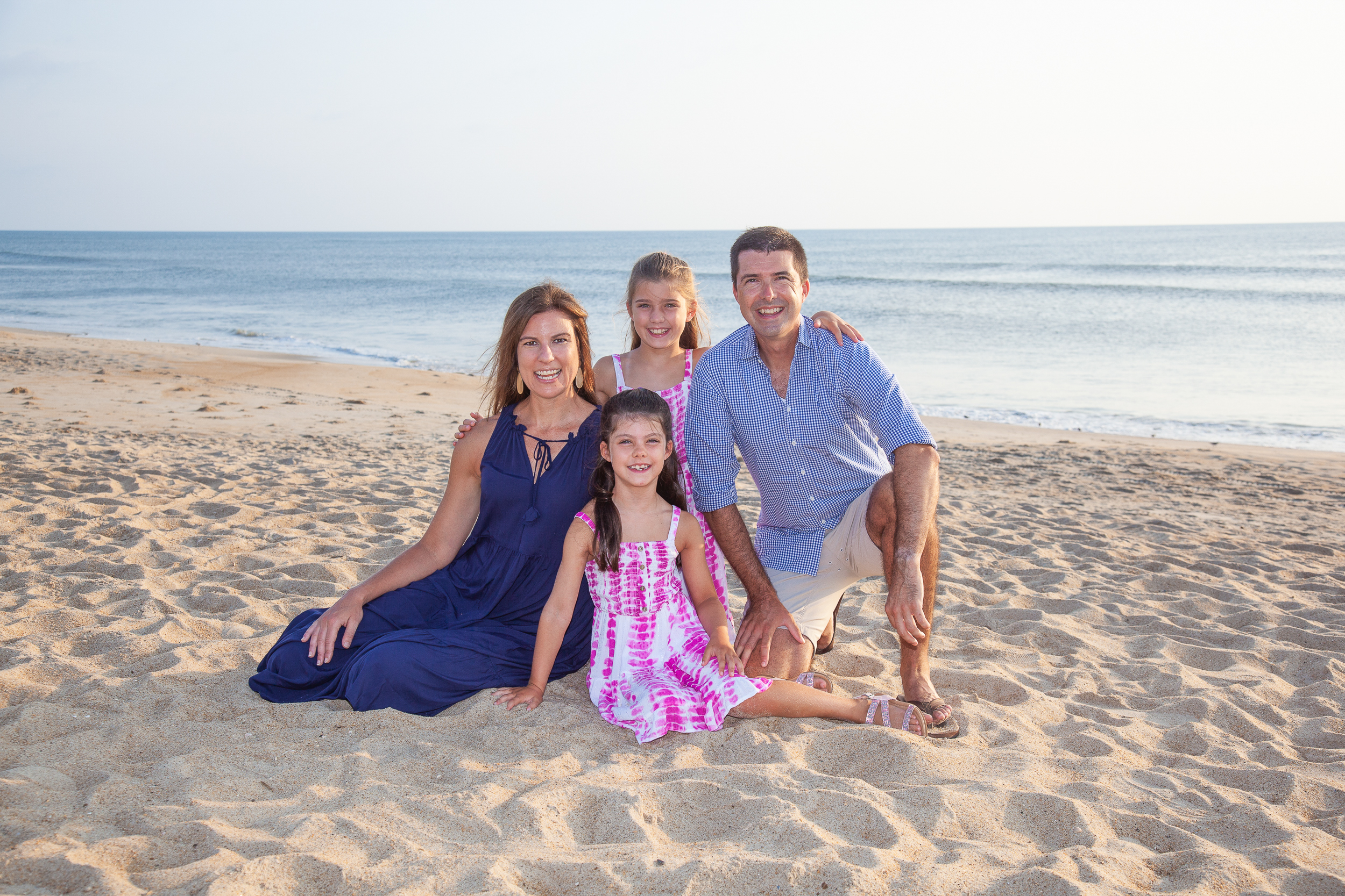 a portrait of a family on the beach in Corolla NC